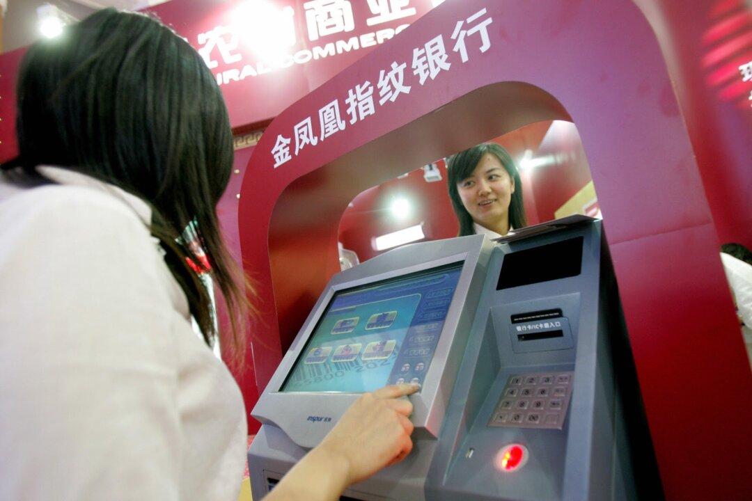 Tricked Into Making a $400 Transaction, Chinese Woman Uses Coke to Destroy ATM