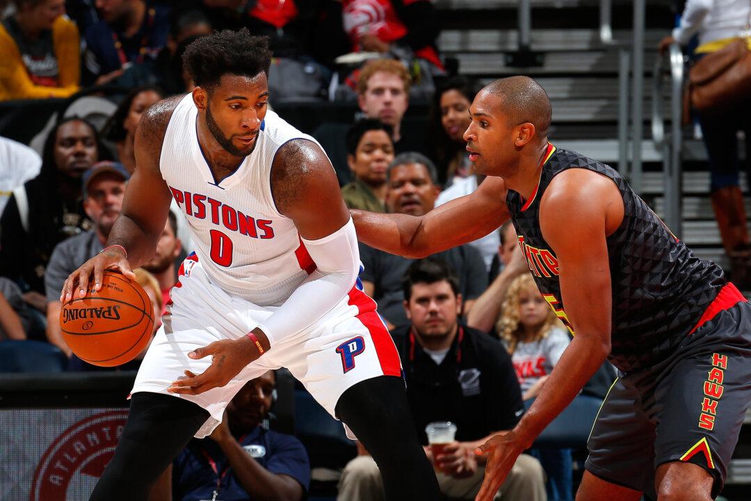 Andre Drummond: Detroit Pistons Center Talks to Young Fan on Bench During Game