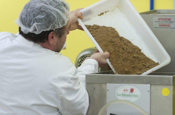 An employee of the factory "L'Atelier a pates" ("The pasta shop") empties a basket with some flour of insects (locusts or crickets) to make pasta (Jean-Christophe Verhaegen/AFP/Getty Images)