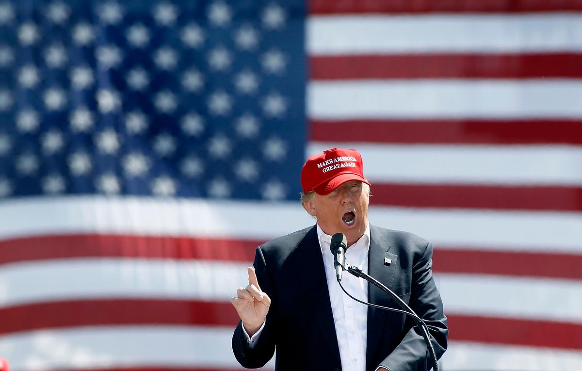 Video: Black Man Punches, Stomps on White Trump Protester Wearing KKK Hood