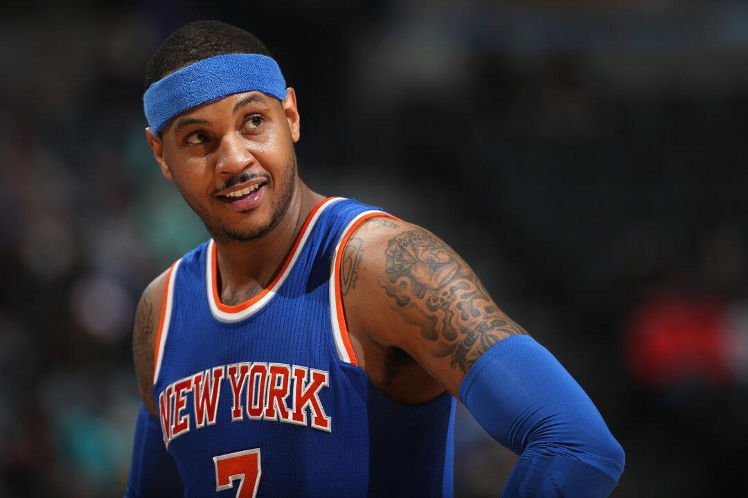 Kid Rushes Onto Court to Hug Carmelo Anthony