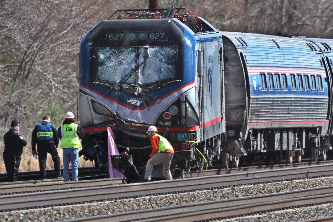 Officials: Amtrak Engineer Hit Brakes Seconds Before Crash