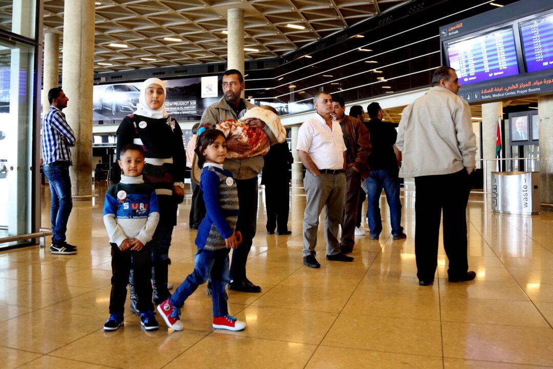 First Syrians Leave for US Under Surge Resettlement Program