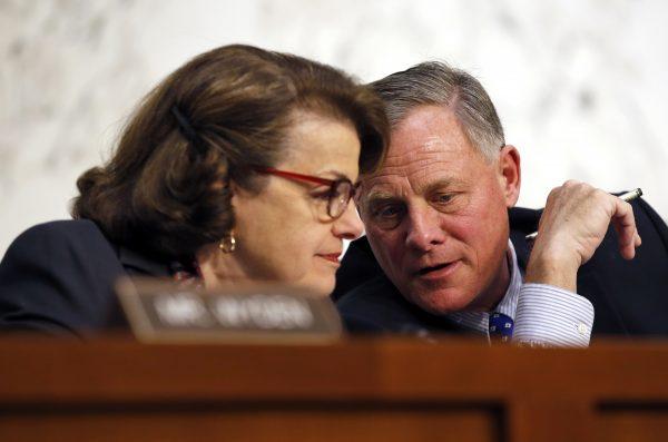 Senate Intelligence Committee Vice Chair Sen. Dianne Feinstein (D-Calif.) talks with Chair Sen. Richard Burr (R-N.C.) on Capitol Hill in Washington in February 2016. (AP Photo/Alex Brandon, File)