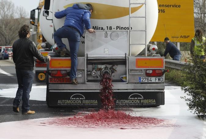 France Wages Wine-War on Spain; Dumps Roughly 90,000 Bottles of Spanish Wine Into Streets