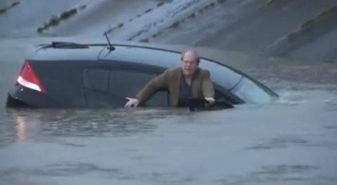 Reporter Rescues Man From Flooded Car on Live TV