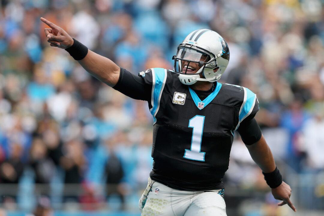 Cam Newton: Carolina Panthers Quarterback Hops Fence to Play Football With 7th Graders