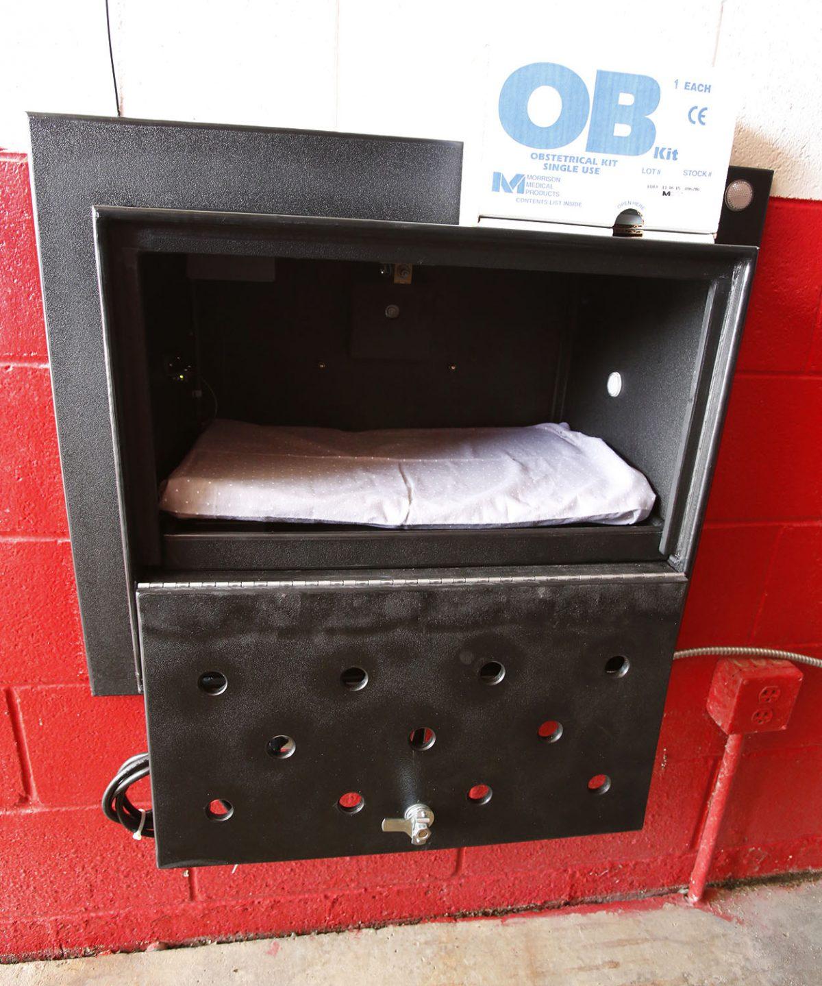 A padded, climate-controlled Safe Haven Baby Box was dedicated at the Woodburn Volunteer Fire Department in Woodburn, Ind., on April 26, 2016. (Chad Ryan/The Journal Gazette via AP)