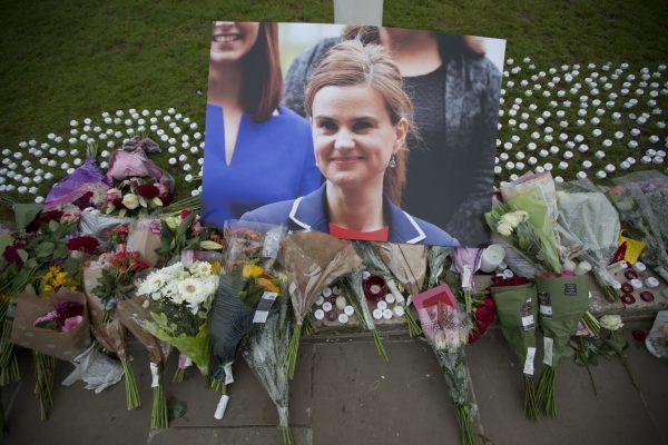 Floral tributes for Jo Cox lay on Parliament Square, outside the House of Parliament in London, on June 17, 2016. (Matt Dunham/AP Photo)