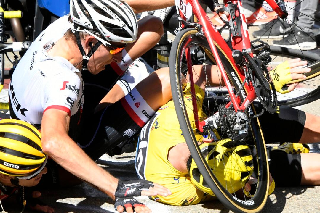 Climbing Catastrophe: Chris Froome Brought Down by Motorcycle Collision in Tour de France Stage 12