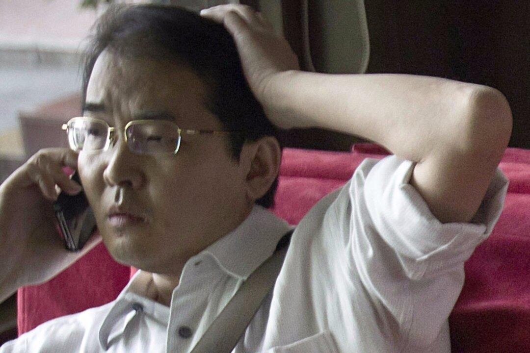 Chinese Activist Lawyer Sentenced to 12 Years on Fraud Charges
