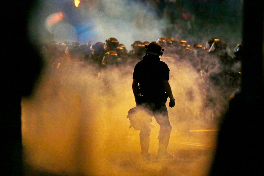 Report: Charlotte Rioters Try to Throw Photographer into Fire