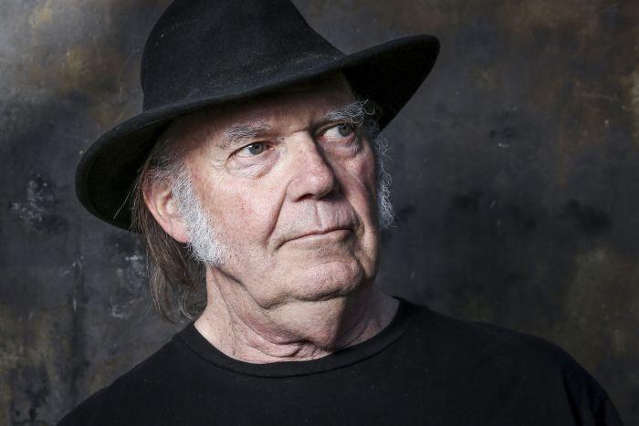 Neil Young Urges Spotify Employees to Quit Their Jobs, Tells Fans to Withdraw Money From Big American Banks