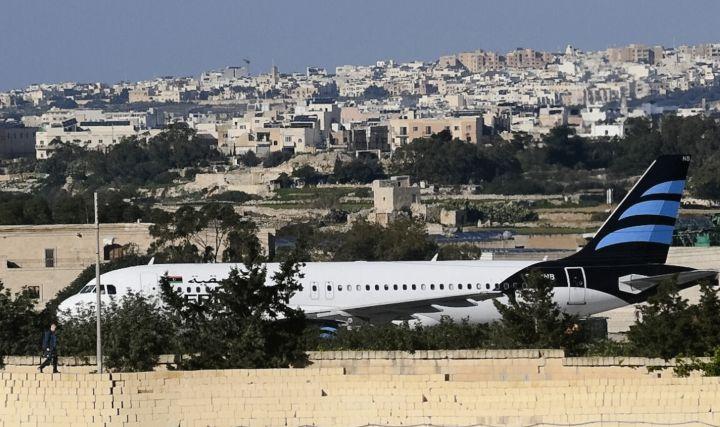 Hijackers Threaten to Blow up Libyan Plane; Free 65 People