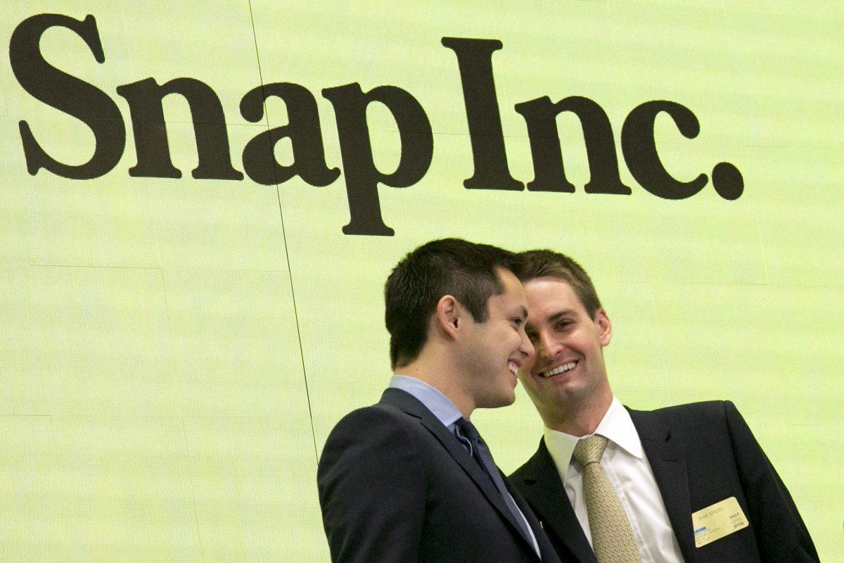 Snapchat co-founders Bobby Murphy (L) and CEO Evan Spiegel ring the opening bell at the New York Stock Exchange as the company celebrates its IPO on March 2, 2017. (Richard Drew/AP Photo)