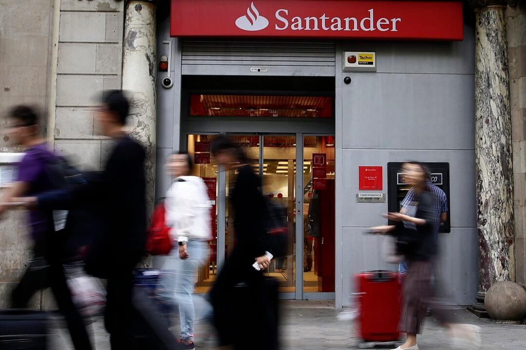Santander Posts 11-Billion-Euro Loss for First Half, Confident About Outlook