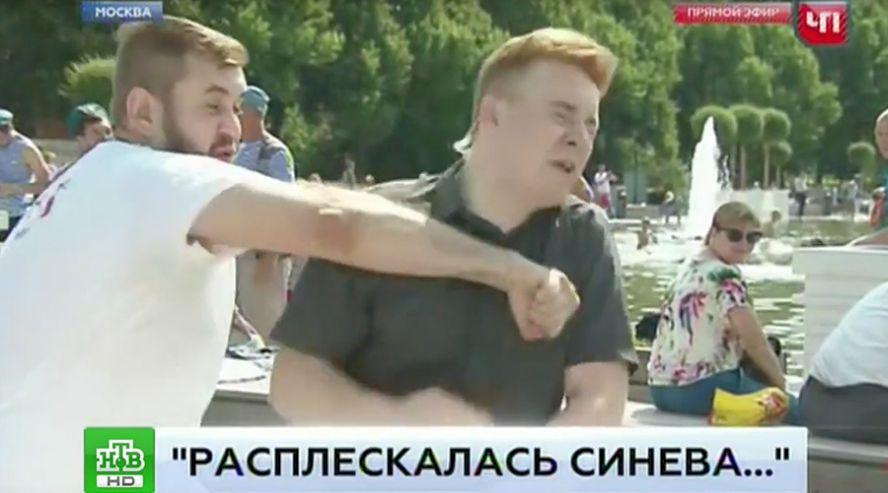 Russian Reporter Punched in the Face Live on TV