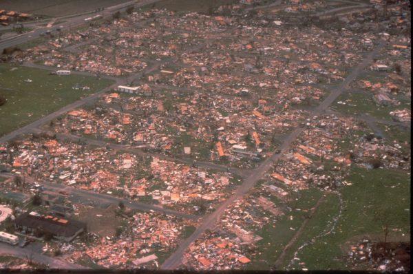 An aerial view of Dade County, Florida, shows the damage Hurricane Andrew wrought on a mobile home park when it struck in a large mobile home park in mid-August, 1992. One million people were evacuated and 54 died in the hurricane. (Bob Epstein/FEMA News Photo/via Wikimedia Commons)