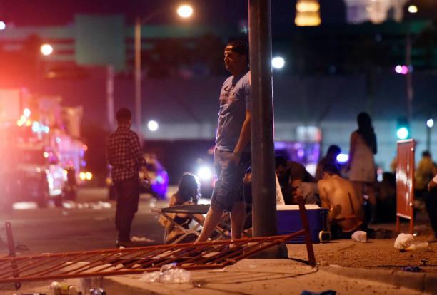 A man stands outside the the Route 91 Harvest country music festival grounds after an active shooter was reported in Las Vegas on Oct. 1, 2017 . (Photo by David Becker/Getty Images)