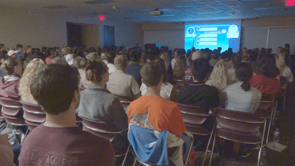 Attendees watching the documentary "Harvested Alive" at Texas A&M University on Sept. 28, 2017. (The Epoch Times)