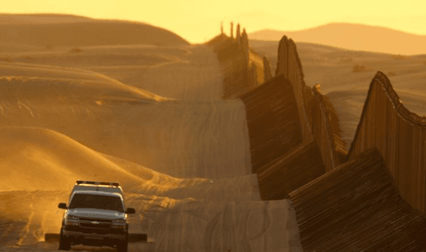 A Border Patrol vehicle drags the sand to make any new footprints of border crossers more visible along the US–Mexico border fence expansion between Yuma, Ariz., and Calexico, Calif., on March 14, 2009. (David McNew/Getty Images)