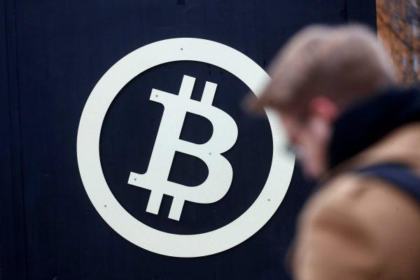 A bitcoin sign is seen during Riga Comm 2017, a business technology and innovation fair in Riga, Latvia, on Nov. 9, 2017. (Reuters/Ints Kalnins)