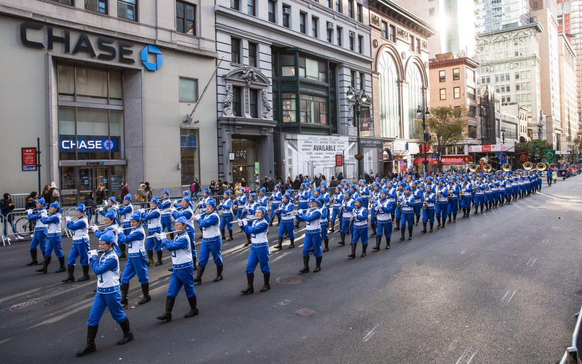 The Tian Guo (Divine Land) Marching Band from the Falun Dafa spiritual practice, participate in the Veterans Day Memorial parade in New York on Nov. 11, 2017. (Benjamin Chasteen/The Epoch Times)