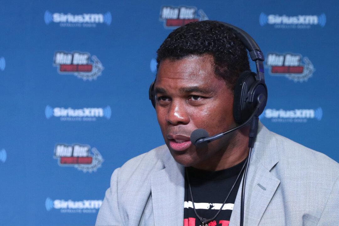 Walker and Sen. Warnock Bicker Over Terms of Debate in Georgia