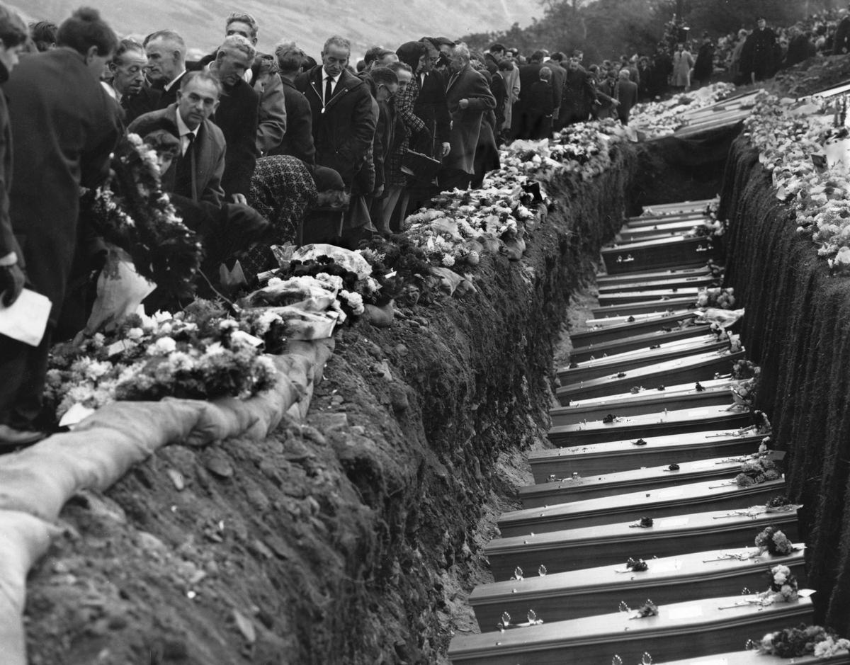 Inhabitants of the Welsh mining village of Aberfan attend the mass funeral for children and adults who perished when a landslide engulfed the junior school. (George Freston/Getty Images)
