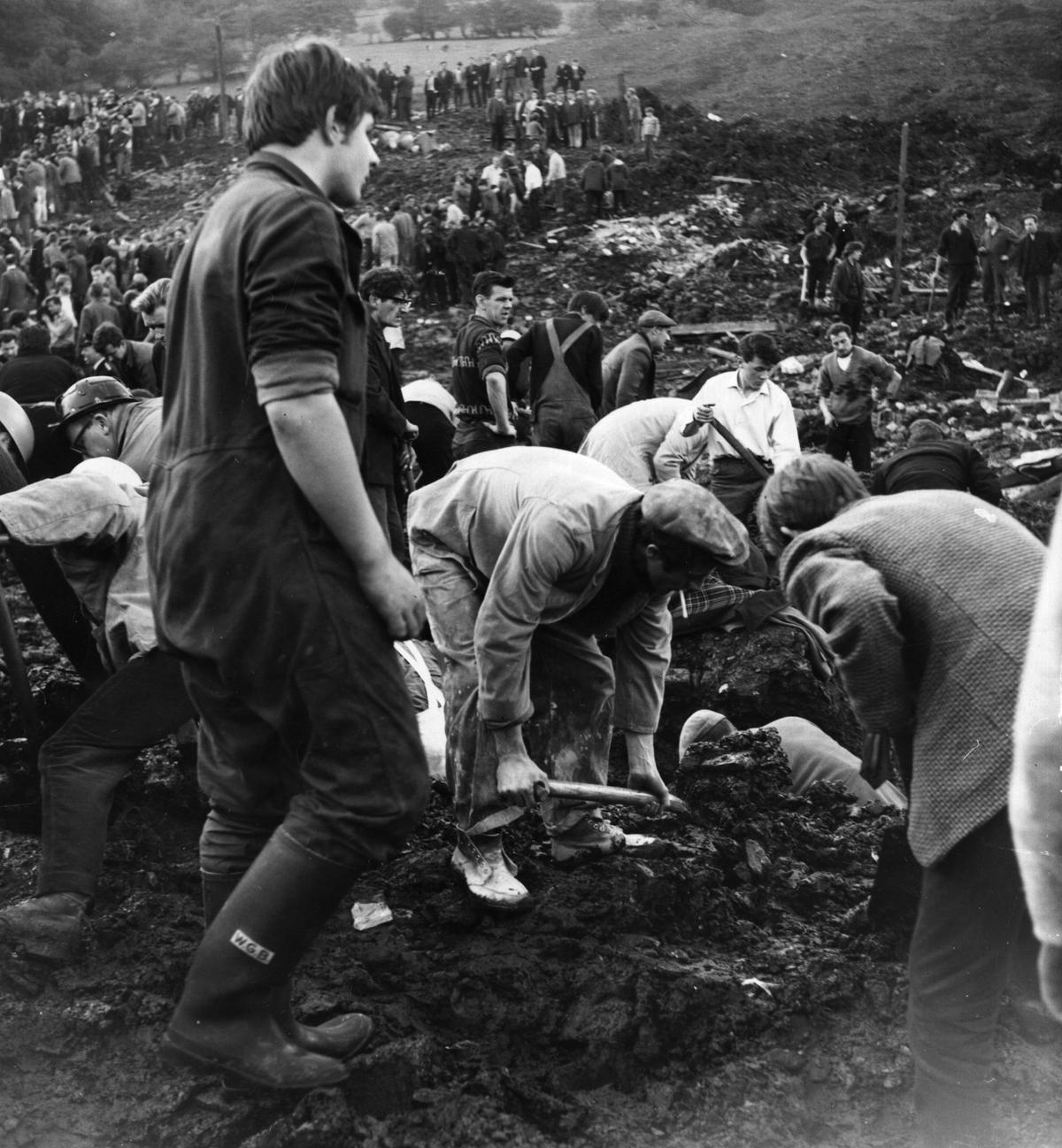 Rescue workers clearing debris and sludge on Oct. 22, 1966, near the wrecked Pantglas Junior School at Aberfan, South Wales, where a coal tip collapsed killing many children. (Keystone/Getty Images)