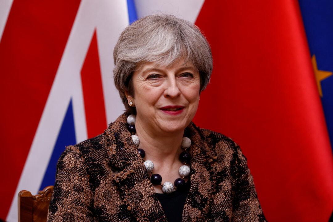 UK PM May Says Trump Committed to Best Interests of United States