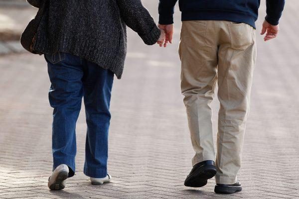 An elderly couple walk around Manly promenade on June 2, 2016 in Australia. (Brendon Thorne/Getty Images)