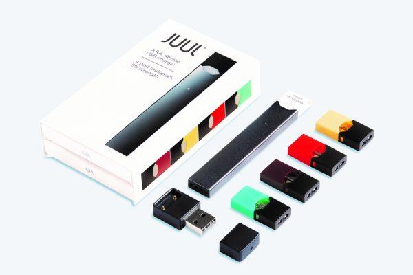Colorful nicotine-filled pods, pictured on the right, are inserted into the Juul e-cigarette, which educators say looks deceptively like a flash drive, making it harder to identify. (Courtesy of Juul Labs)