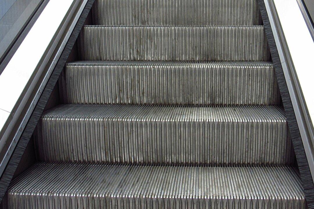 Man On Escalator Gets Swallowed By The Running Stairs