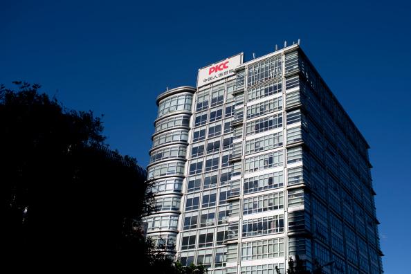 People's Insurance Company (Group) of China Ltd. (PICC) signage is displayed on a building in Beijing, China, on Monday, Sept. 8, 2014 (Brent Lewin/Bloomberg via Getty Images)