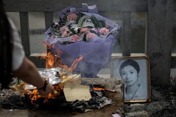 Relatives of earthquake victims burn offerings at the ruins of earthquake-hit Beichuan county during the ten year anniversary of the Earthquake on May 12, 2018 in Beichuan Qiang Autonomous County, Sichuan province China.(Wang He/Getty Images)