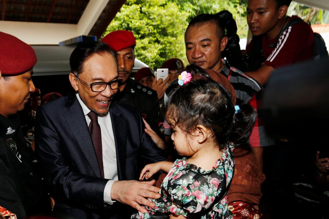 Malaysia’s Anwar Walks Free After Royal Pardon, Meets Mahathir