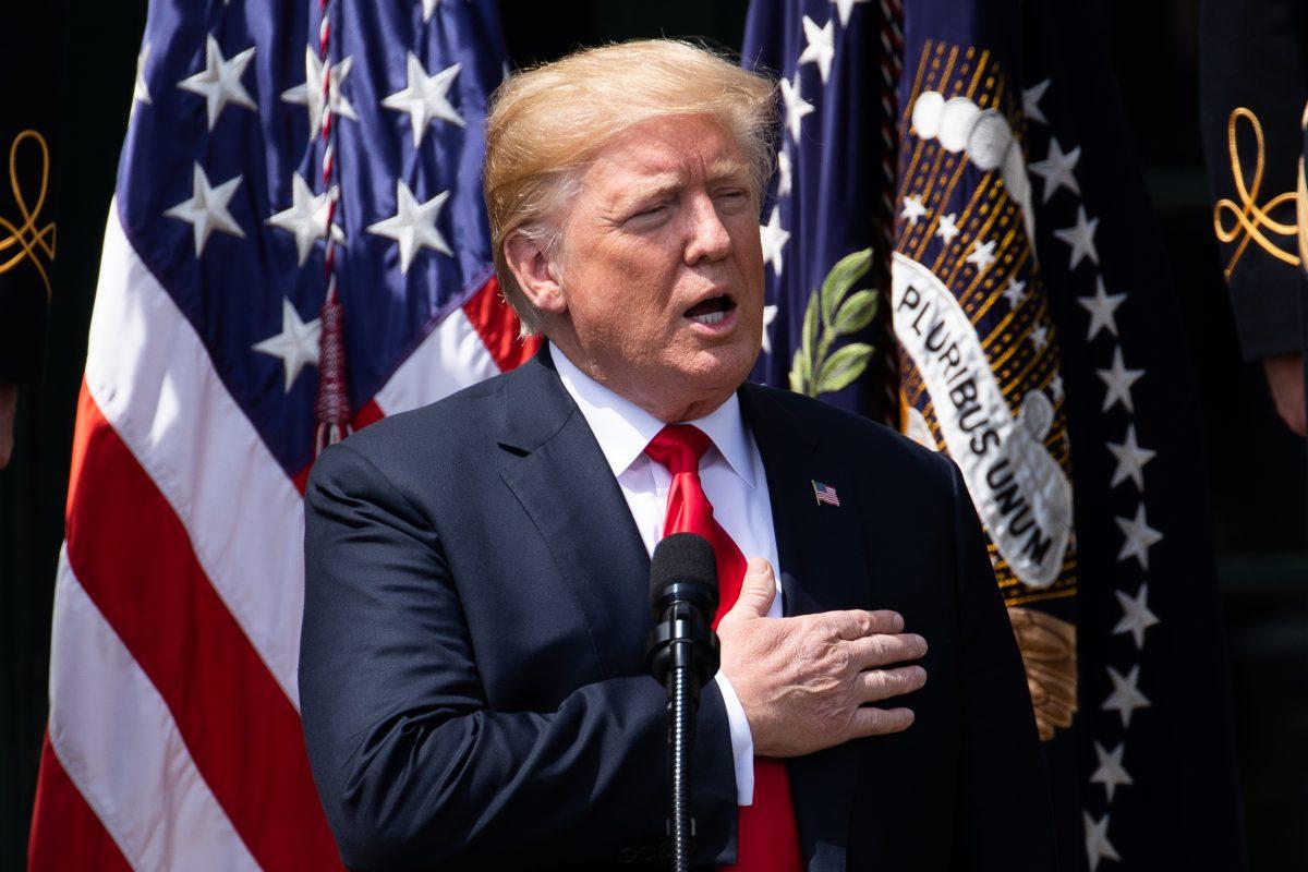 President Donald Trump sings the national anthem during the Celebration of America on the South Lawn of the White House in Washington on June 5, 2018. (Samira Bouaou/The Epoch Times)