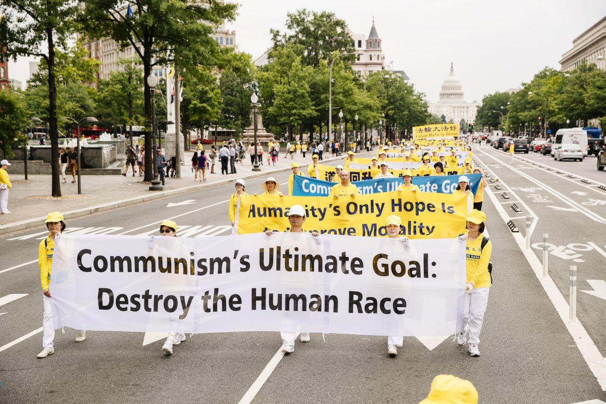 Falun Gong practitioners march down Pennsylvania Ave. on June 20, 2018, in Washington. (Edward Dye/Epoch Times)