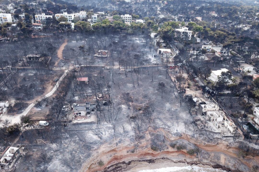 Greeks Seek Answers as Fire Toll Mounts
