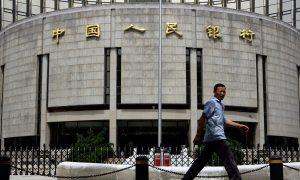 People’s Bank of China Cuts Foreign Exchange Assets by a Third