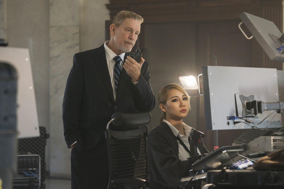 John Malkovich and Lee Chae-rin (better known by her stage name CL, a South Korean singer-songwriter) star in “Mile 22.” (Motion Picture Artwork/STX Financing, LLC)
