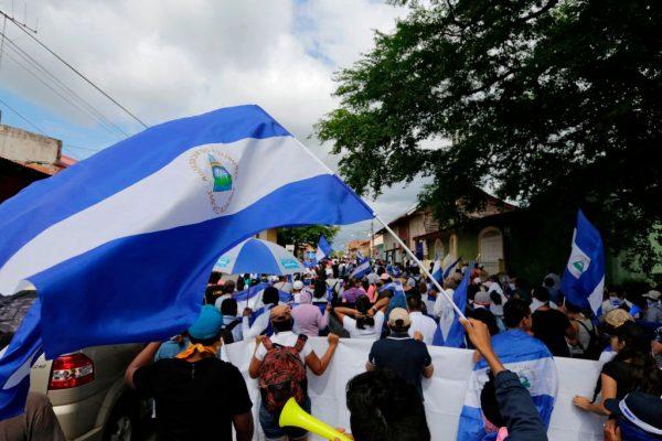 Anti-government protesters take part in a march dubbed 'United Nicaragua will never be defeated' in Granada, Nicaragua on Aug. 25, 2018. Thousands marched Saturday in different cities in Nicaragua demanding the freedom of political prisoners and the removal of Nicaraguan President Daniel Ortega. (INTI OCON/AFP)