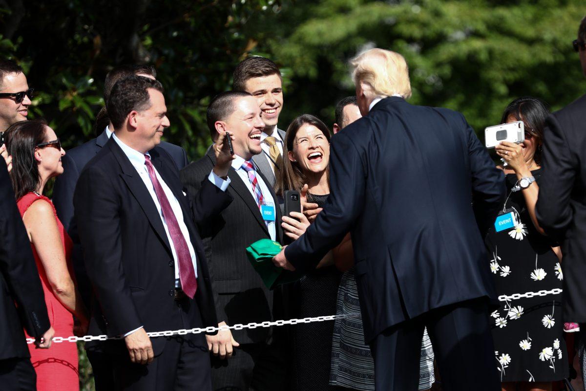 President Donald Trump greets supporters before departing from the White House for a Make America Great Again Rally in Evansville, Ind., on Aug. 30, 2018. (Samira Bouaou/The Epoch Times)