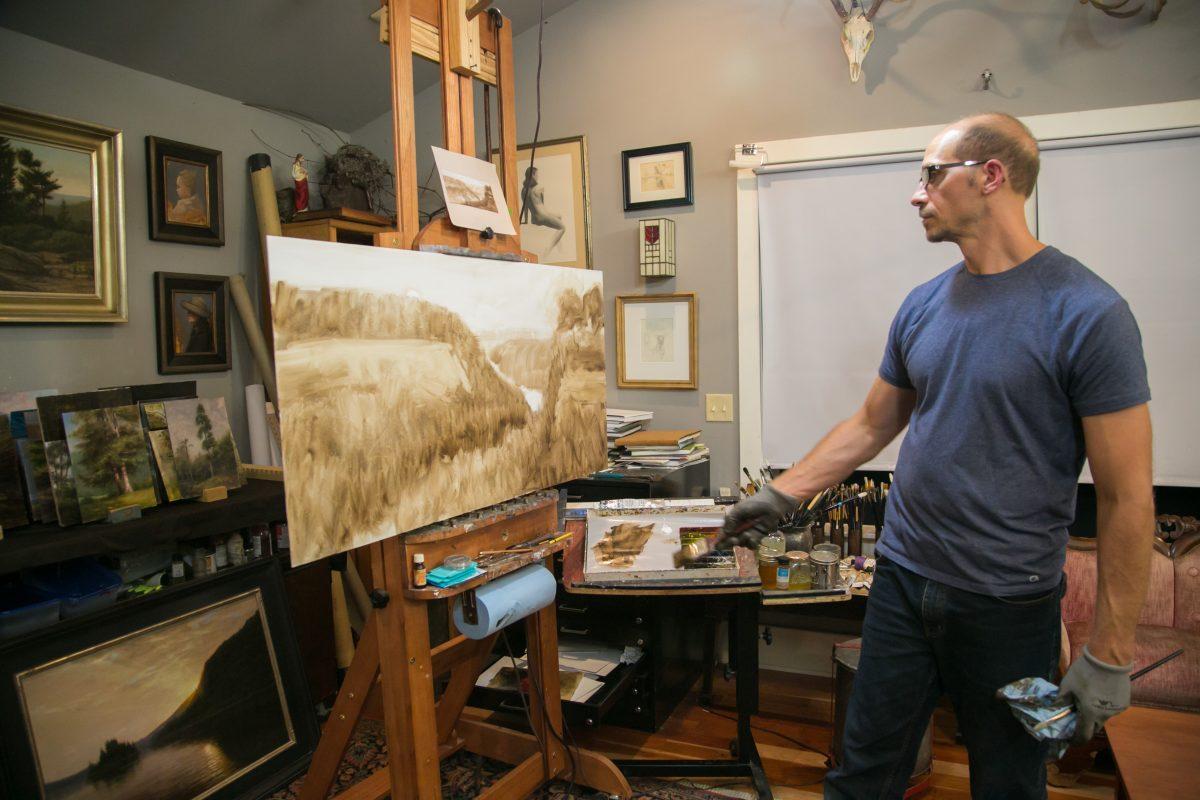 Thomas Kegler paints in his studio in East Aurora, N.Y., on Aug. 17, 2018. (Milene Fernandez/The Epoch Times)