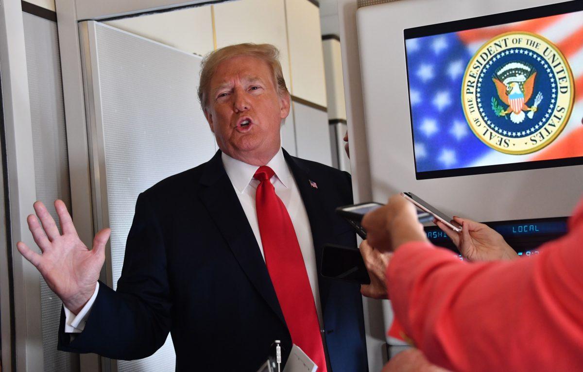 President Donald Trump speaks to the press aboard Air Force One as he travels to Fargo, N.D., on Sept. 7, 2018. (NICHOLAS KAMM/AFP/Getty Images)