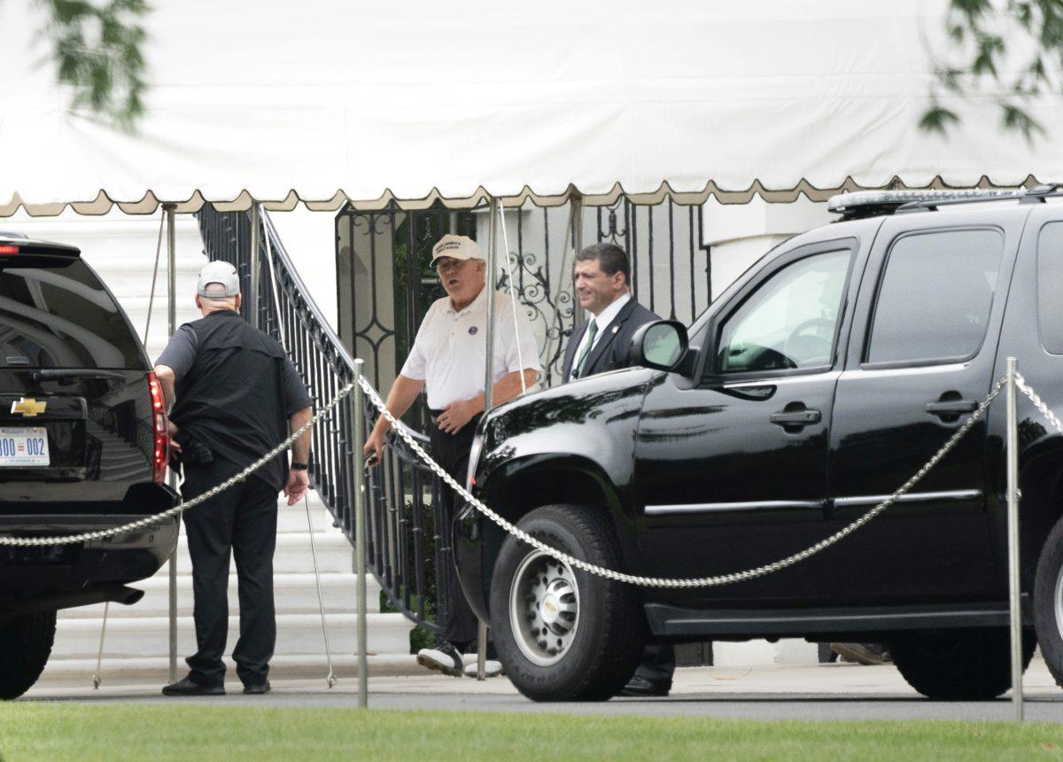 President Donald Trump boards his motorcade at the White House in Washington, on Sept. 8, 2018. The president is heading to Trump International Golf Club in Sterling, Va. (Chris Kleponis - Pool/Getty Images)