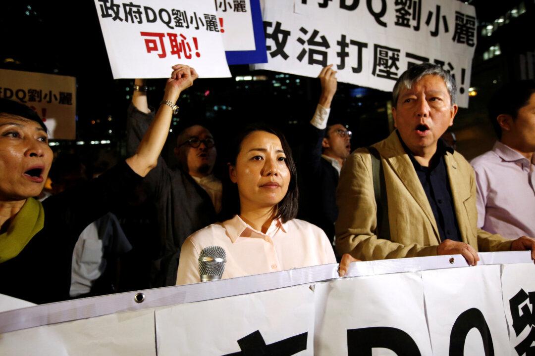 Activists Protest as Hong Kong Disqualifies Pro-Democracy Candidate