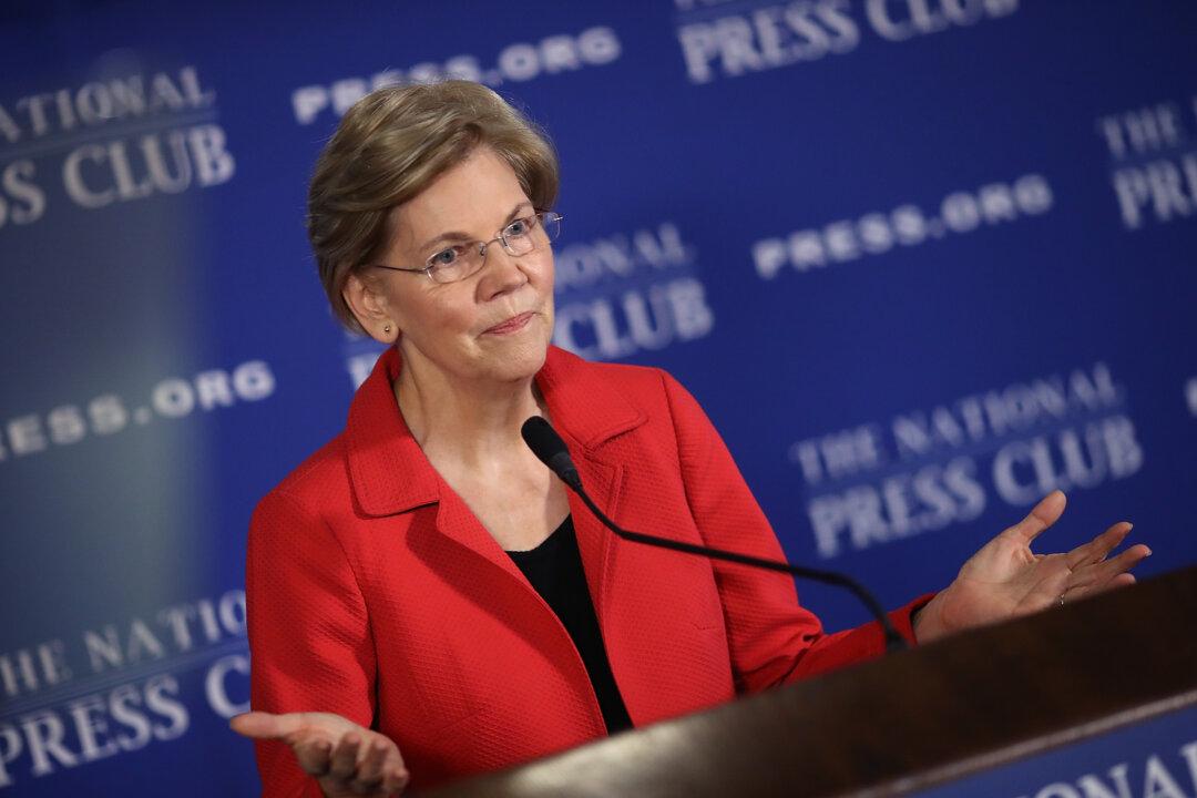Warren Accuses Police Officer Cleared by Obama’s DOJ of Murdering Michael Brown