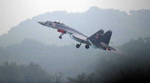 A Sukhoi SU-35 fighter jet takes off during a test flight ahead of the Airshow China 2014 in Zhuhai, a city in southern China's Guangdong Province, on Nov. 10, 2014. (Johannes Eisele/AFP/Getty Images)